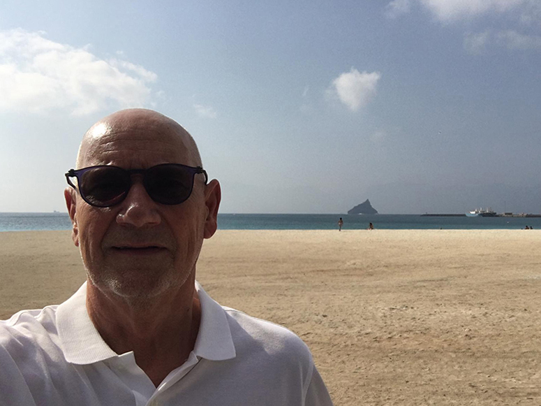 Selfie taken by Markku Mylly. In the background is a sandy beach.