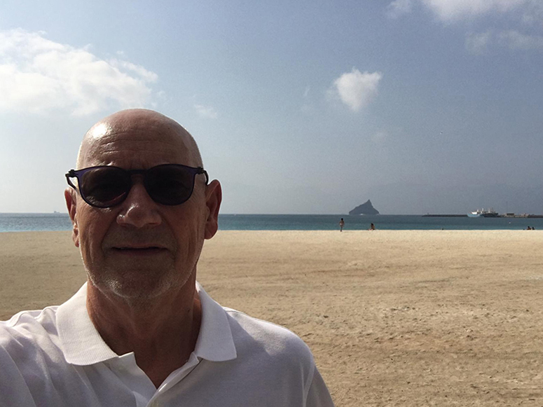 Markku MyllyKap Verde Selfie taken by Markku Mylly. In the background is a sandy beach.