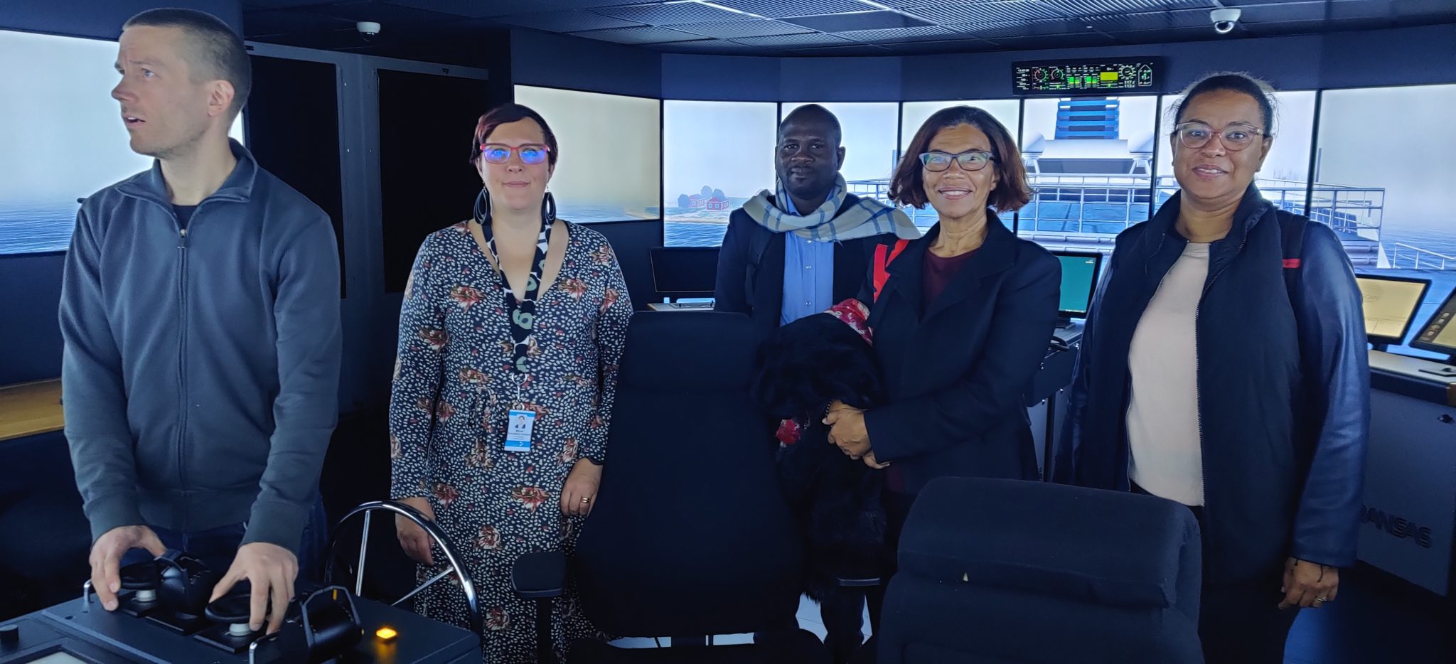 Visitors in the navigation simulator at the Rauma campus.