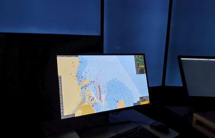 A map displayed on a computer screen. The room is dark.
