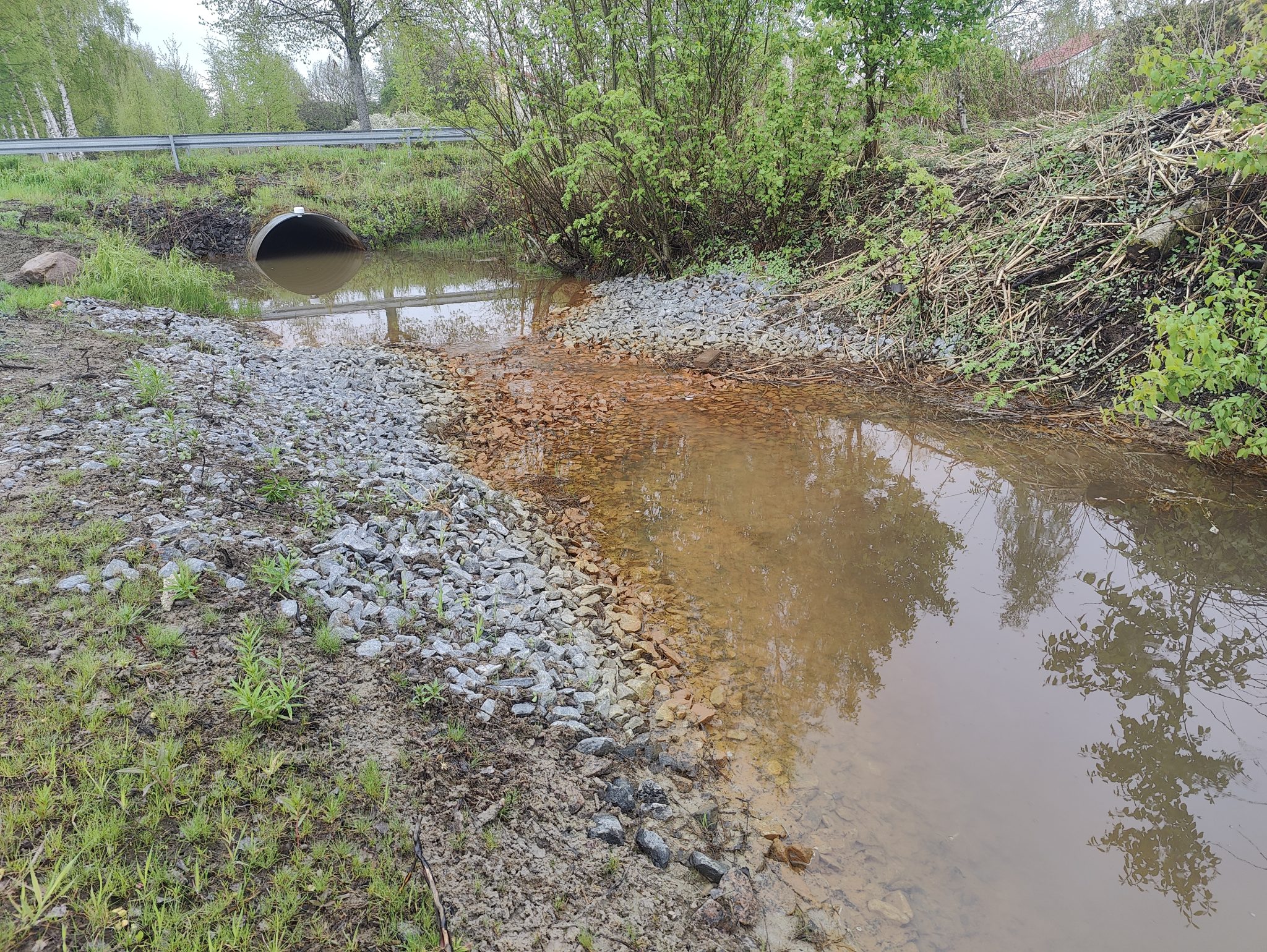 A ditch with water in it.