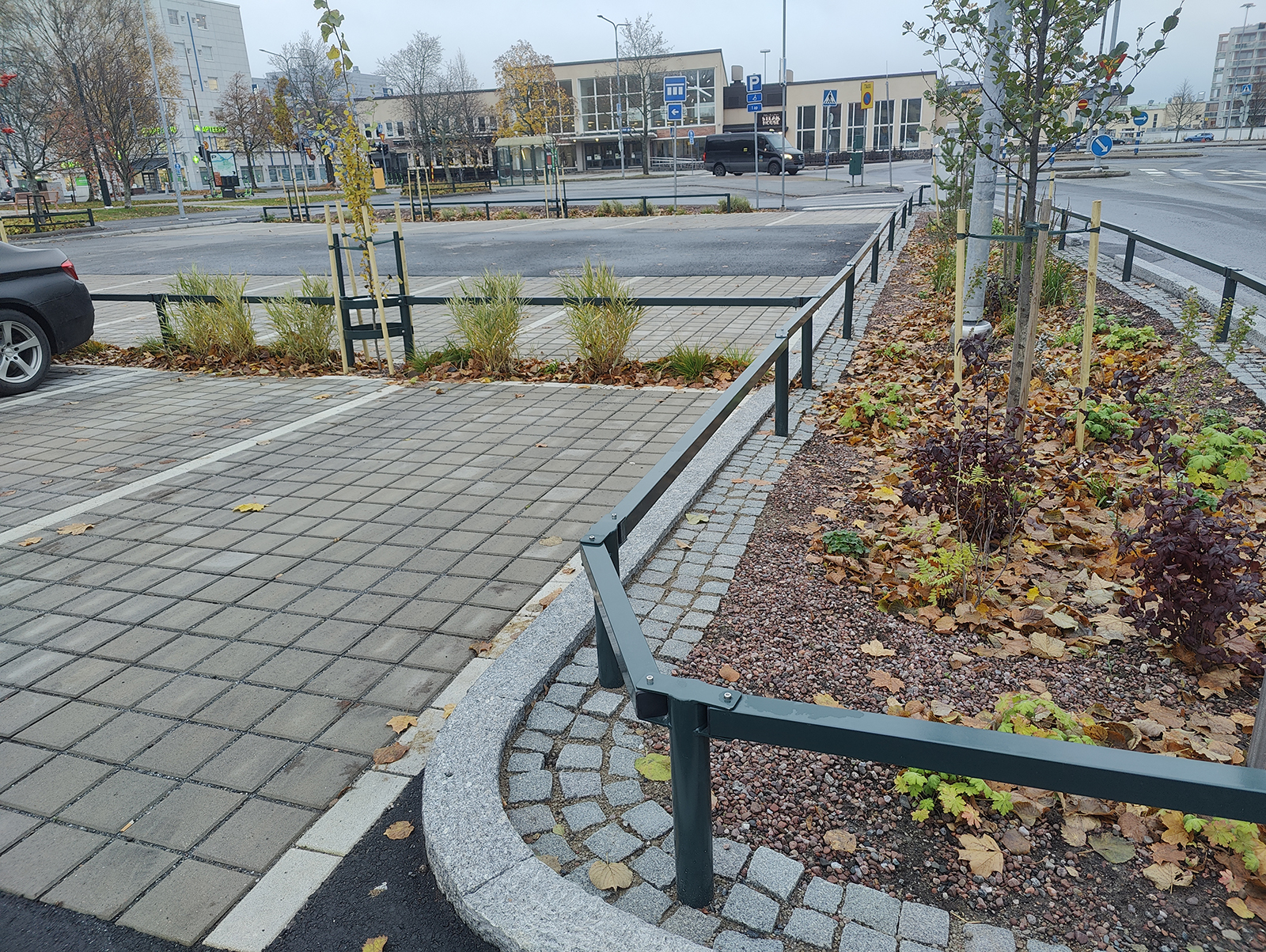 Cobblestones and plantings next to the parking lot.