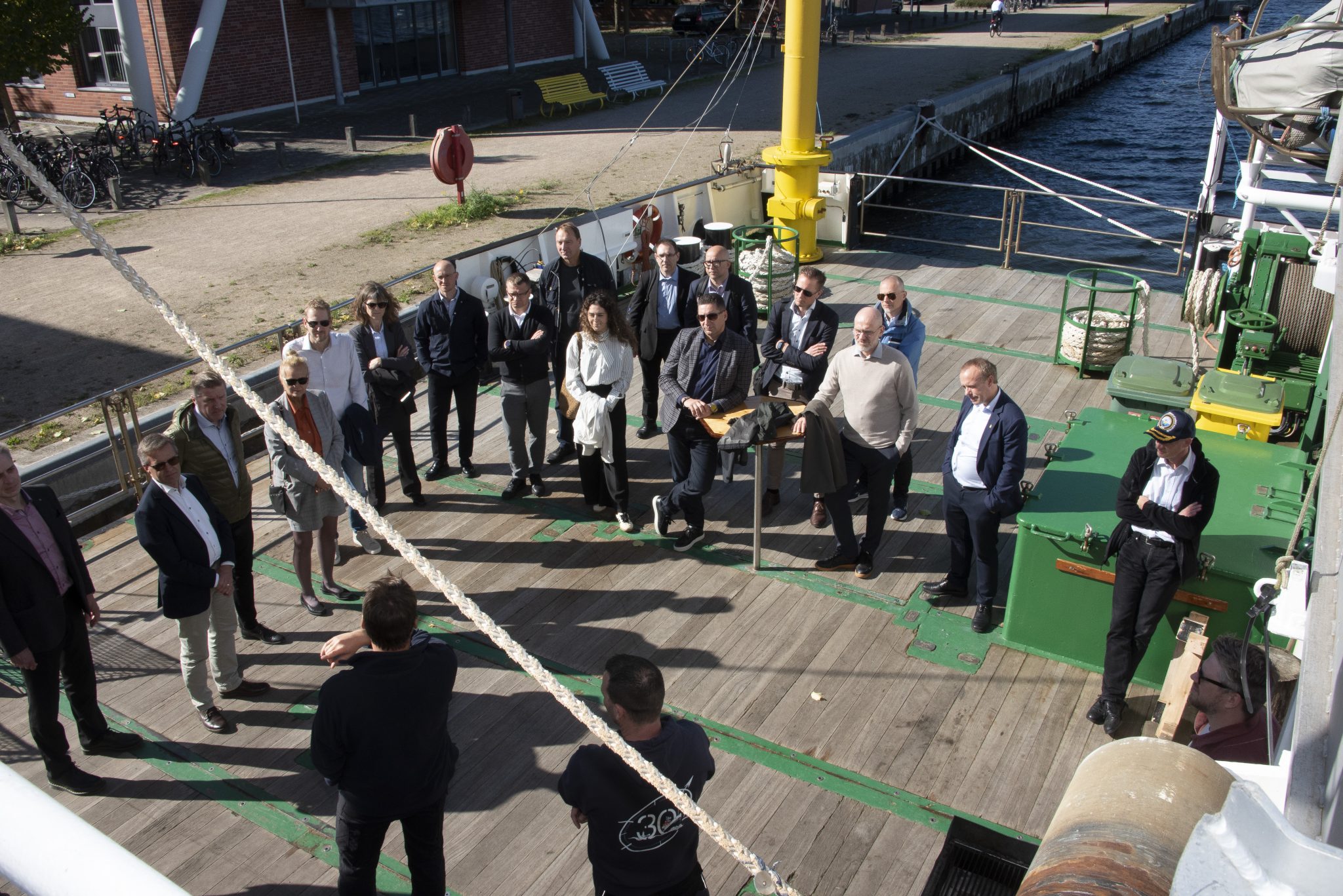 Participants gathered on the deck of the research vessel Deneb during a vessel presentation.