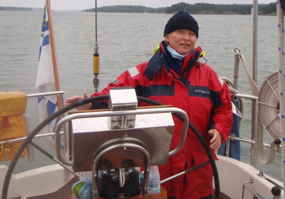 Meri-Maija Marva steers the sailboat.